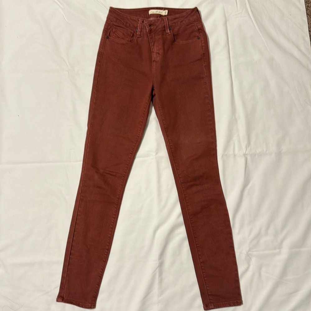 Unpublished brick red, high rise jeans.